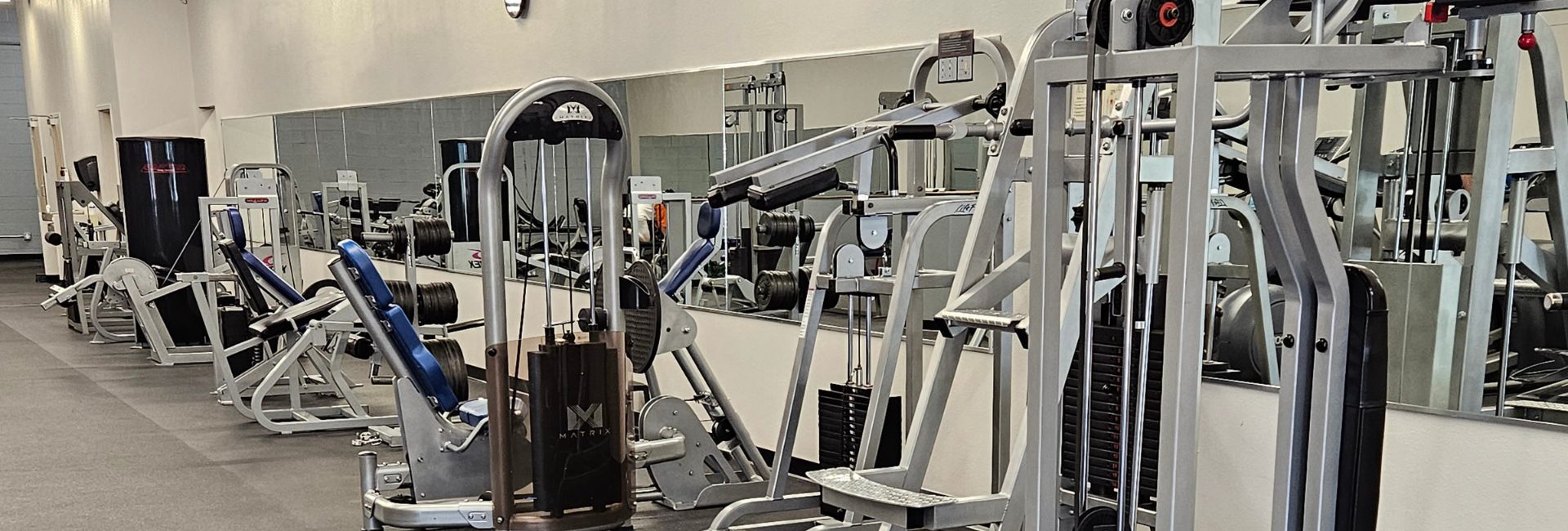 an open gym floor with both cardio equipment and strength training equipment at a circuit training gym in north valley albuquerque