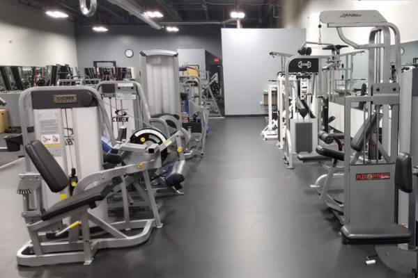 an open gym floor with circuit training equipment at an albuquerque gym